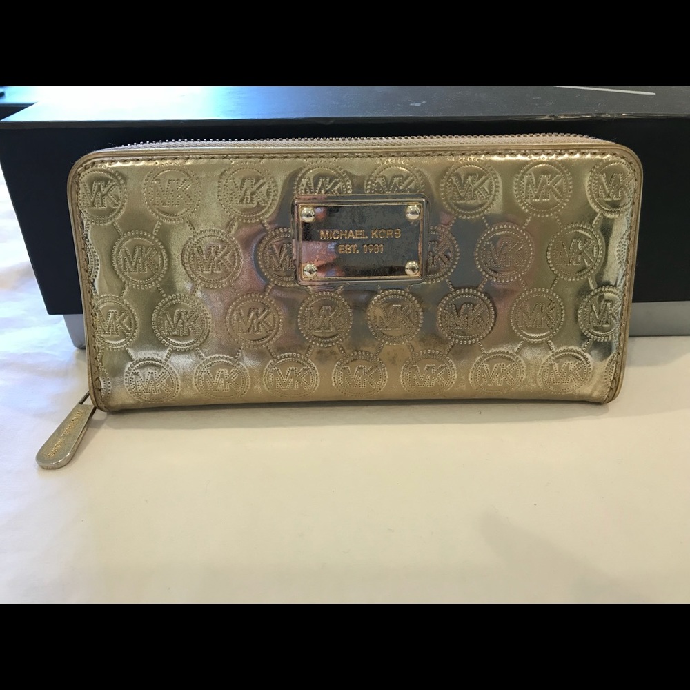 Womens metallic gold Michaels Kors wallet